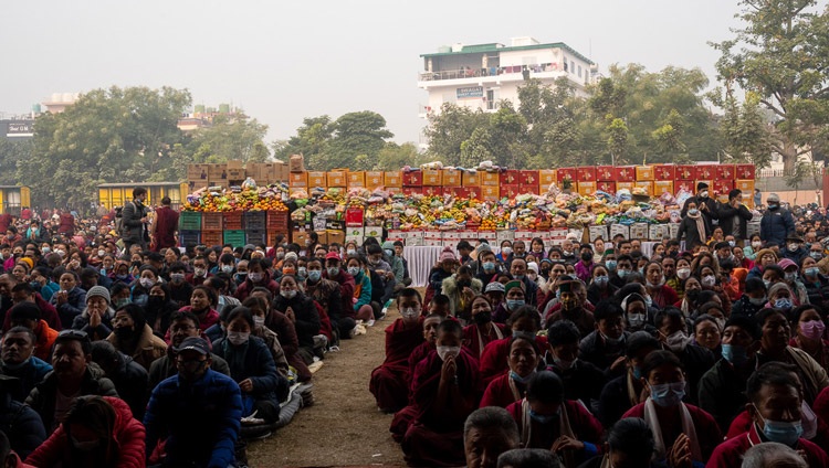 Offerings to be distributed to the crowd stacked high at the back of the Kalachakra Teaching ground during the Long Life Prayers offered to His Holiness the Dalai Lama by the Geluk Tradition in Bodhgaya, Bihar, India on January 1, 2023. Photo by Tenzin Choejor