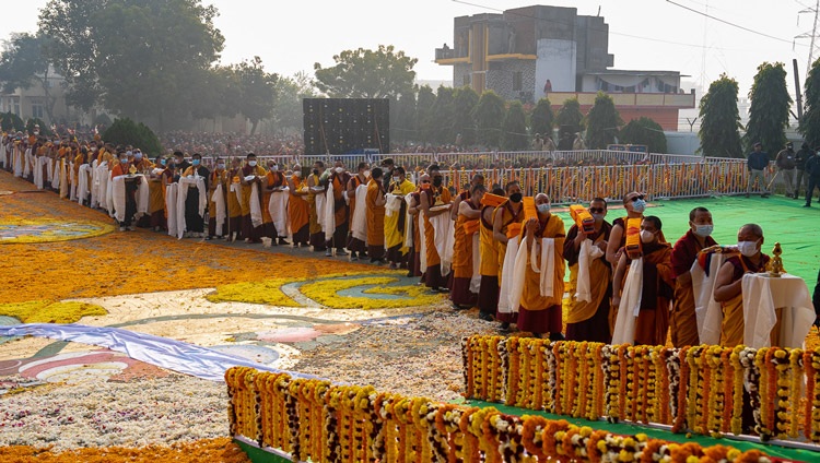 Members of the Nyingma Tradition lined up holding offerings to present to His Holiness the Dalai Lama during Long Life Prayers at Palyul Namdroling Monastery in Bodhgaya, Bihar, India on January 18, 2023. Photo by Tenzin Choejor