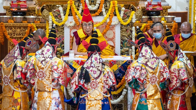 Monks dressed in ornate costumes as dakinis taking part in the Long Life Prayer offered to His Holiness the Dalai Lama at the Main Tibetan Temple in Dharamsala, HP, India on March 15, 2023. Photo by Tenzin Choejor