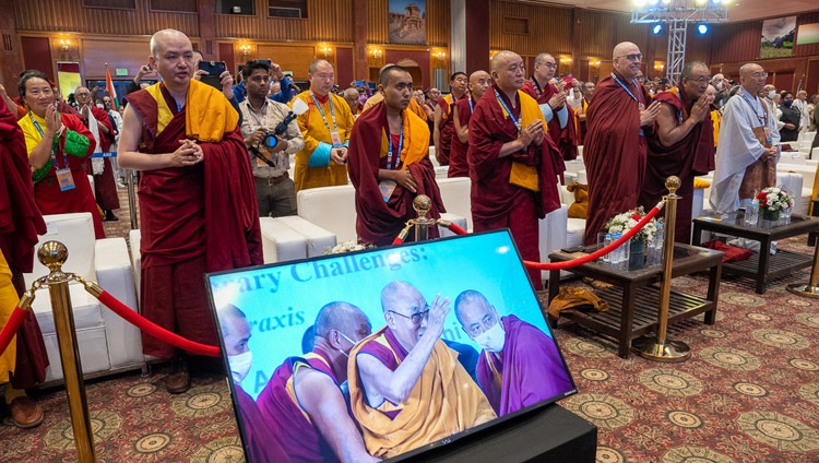 Delegates to the Global Buddhist Summit 2023 on their feet as His Holiness the Dalai Lama arrives at the meeting hall at the Ashok Hotel in New Delhi, India on April 21, 2023. Photo by Tenzin Choejor