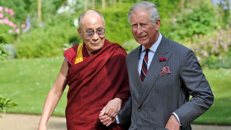 His Holiness the Dalai Lama and Prince Charles walking on the grounds of Clarence House in London, UK, on June 21, 2012.