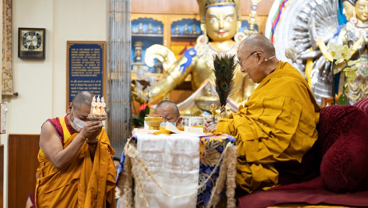 A Namgyal monk assisting His Holiness the Dalai Lama with rituals during the Manushri Permission at the Main Tibetan Temple in Dharamsala, HP, India on May 31, 2023. Photo by Tenzin Choejor