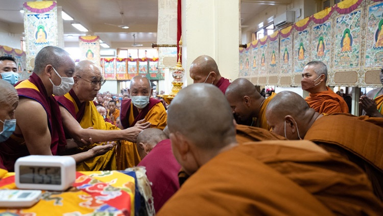 His Holiness the Dalai Lama greeting a group of Theravada monks as he arrives inside the Main Tibetan Temple for his teaching commemorating the Buddha's birth and enlightenment in Dharamsala, HP, India on June 4, 2023. Photo by Tenzin Choejor