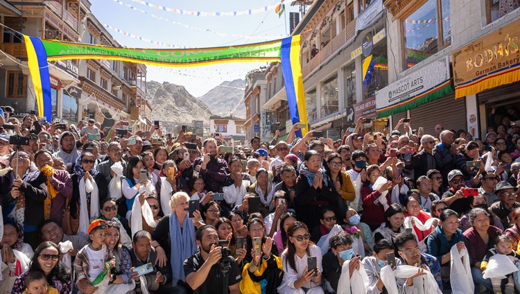Members of the local community and tourists visiting Ladakh crowd into the square outside the Jokhang hoping to see His Holiness the Dalai Lama as he departs at the conclusion of his visit to the Jokhang in Leh, Ladakh, India on July 14, 2023. Photo by Tenzin Choejor