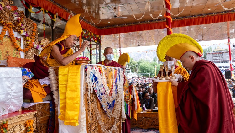 Taktsak Kundeling Rinpoché presenting an extensive mandala offering during the prayers for the long life of His Holiness the Dalai Lama at Shewatsel Teaching Ground in Leh, Ladakh, India on July 24, 2023. Photo by Tenzin Choejor