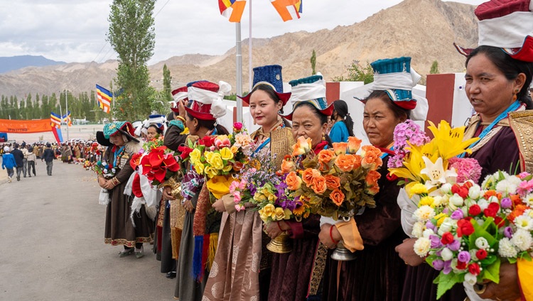 Women in traditional dress lining the road as His Holiness the Dalai Lama's motorcade makes its way to Lamdon Model Senior Secondary School in Leh, Ladakh, India on August 7, 2023. Photo by Ven Zamling Norbu