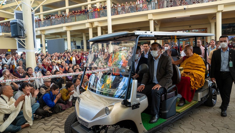 His Holiness the Dalai Lama riding a golf cart back to his residence at the conclusion of the second day of teachings requested by Southeast Asians at the Main Tibetan Temple in Dharamsala, HP, India on September 6, 2023. Photo by Tenzin Choejor