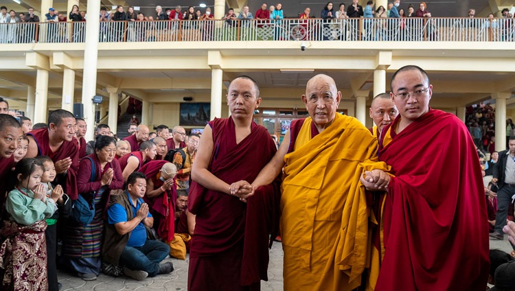 Gaden Tri Rinpoché walking through the Main Tibetan Temple courtyard as he departs at the end of the first day of teachings requested by Taiwanese in Dharamsala, HP, India on October 2, 2023. Photo by Tenzin Choejor