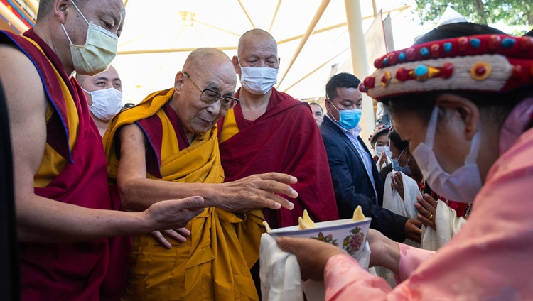 His Holiness the Dalai Lama being offered a traditional welcoming 'Chema Changphu' as he arrives at the Main Tibetan Temple courtyard to attend at long life prayers offered to him by the Institute of Buddhist Dialectics, members of Sera Jé Hardong Khangtsen, the Tibetan Chamber of Commerce and Lha Ngam Phun Sum in Dharamsala, HP, India on October 25, 2023. Photo by Tenzin Choejor