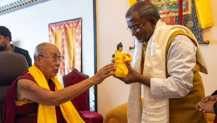 His Holiness the Dalai Lama offering a Buddha statue to the Governor of Sikkim H.E. Lakshman Prasad Achararya during their meeting in Gangtok, Sikkim, India on December 11, 2023. Photo by Tenzin Choejor