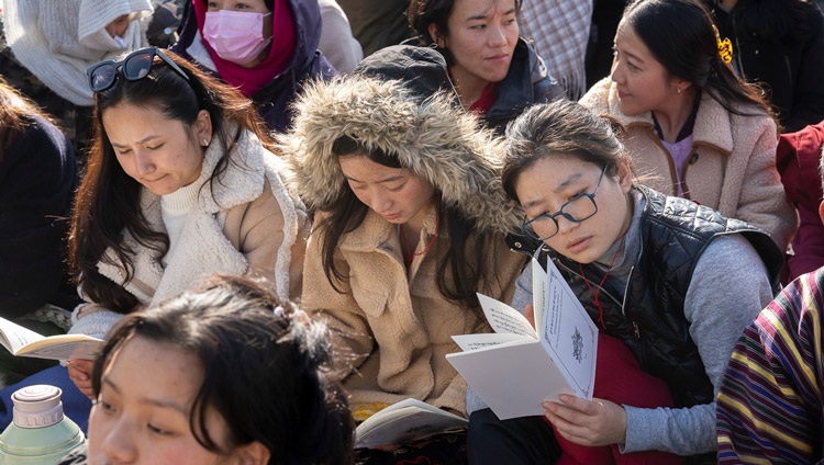 Members of the crowd following His Holiness the Dalai Lama's teachings on Gyalsey Thogmé Sangpo’s "37 Practices of a Bodhisattva" during the teaching at Paljor Stadium in Gangtok, Sikkim, India on December 12, 2023. Photo by Tenzin Choejor