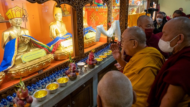 His Holiness the Dalai Lama paying his respects before statues of Jé Tsongkhapa and his chief disciples inside the temple at Sed-Gyued Monastery in Salugara, West Bengal, India on December 14, 2023. Photo by Tenzin Choejor