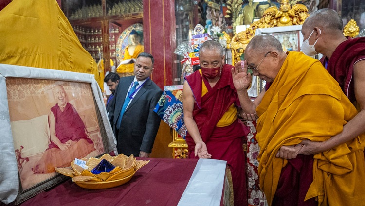 His Holiness the Dalai Lam bowing reverently before an image of his teacher, Ling Rinpoché, during his visit to the Temple at the Tibetan Monastery in Bodhgaya, Bihar, India on December 16, 2023. Photo Tenzin Choejor