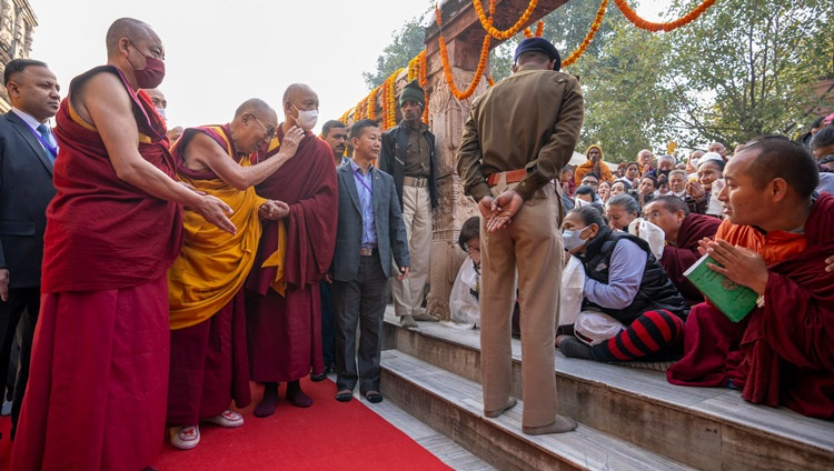 His Holiness the Dalai Lama greeting devotees as he makes his way around the Mahabodhi Temple in Bodhgaya, Bihar, India on December 16, 2023. Photo Tenzin Choejor