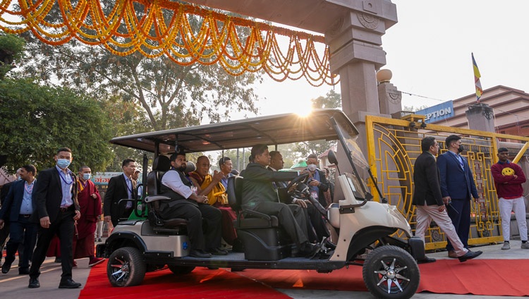 His Holiness the Dalai Lama making his way to the Mahabodhi Temple by electric golf-cart in Bodhgaya, Bihar, India on December 16, 2023. Photo Tenzin Choejor