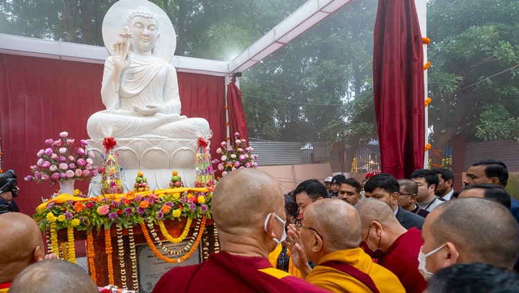 His Holiness the Dalai Lama consecrating a new stone statue of the Buddha commissioned by the Bodhgaya Temple Management Committee (BTMG) at the Kalachakra Ground in Bodhgaya, Bihar, India on December 29, 2023. Photo by Tenzin Choejor