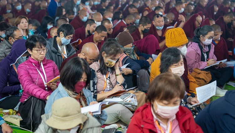 Members of the 50,000 strong crowd following the text ‘In Praise of the Dharmdhatu’ by Nagarjuna being taught by His Holiness the Dalai Lama at the Kalachakra Ground in Bodhgaya, Bihar, India on December 29, 2023. Photo by Tenzin Choejor