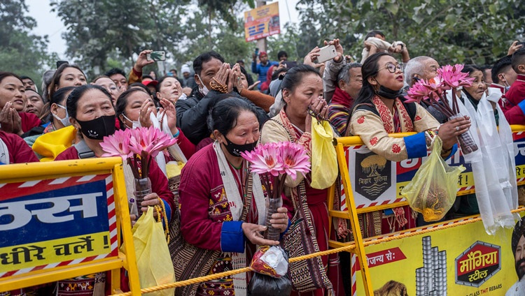 People lining the road from the Tibetan Monastery to the Kalachakra Teaching Ground were eager to catch a glimpse of His Holiness the Dalai Lama on the second day of teachings in Bodhgaya, Bihar, India on December 30, 2023. Photo by Tenzin Choejor