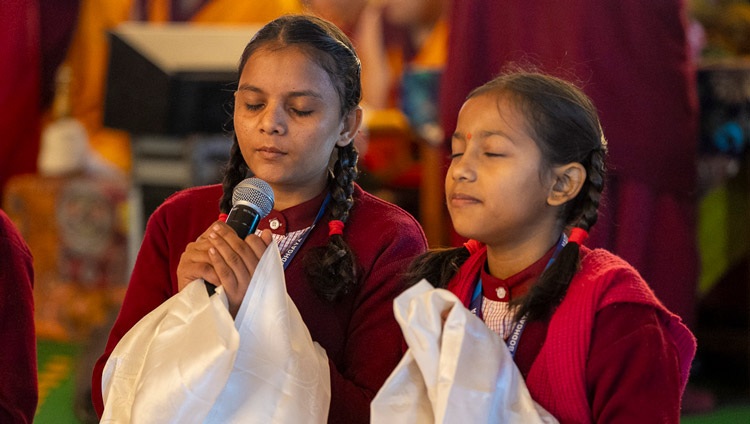 Members of a group of Indian girls, students at the Root Institute School in Bodhgaya, chanting the ‘Heart Sutra’ in Sanskrit at the start of the second day of His Holiness the Dalai Lama's teachings at the Kalachakra Ground in Bodhgaya, Bihar, India on December 30, 2023. Photo by Tenzin Choejor