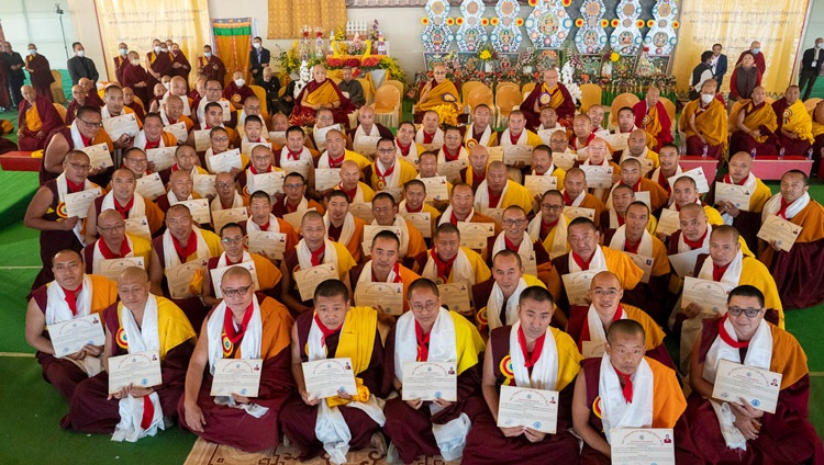 Groups of Geshés gathered around His Holiness to have photographs taken with him after receiving their degrees at the Gelukpa University Convocation and the Award of Geshé Lharampa Degrees at the Kalachakra Ground in Bodhgaya, Bihar, India on January 3, 2024. Photo by Tenzin Choejor