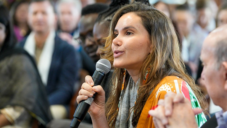 Flavia Neves Maia from Brazil asking His Holiness the Dalai Lama a question on the second day of conversation about leadership with a group of Dalai Lama Fellows at his residence in Dharamsala, HP, India on March 21, 2024. Photo by Ven Tenzin Jamphel