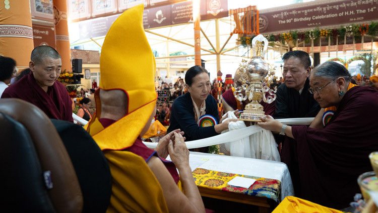 His Holiness the Dalai Lama being presented an award symbolizing him as "The Peerless Teacher of the Twenty-First Century" during celebrations honoring his 90th birthday according to the Tibetan lunar calendar at the Main Tibetan Temple courtyard in Dharamsala, HP, India on June 30, 2025. Photo by Tenzin Choejor