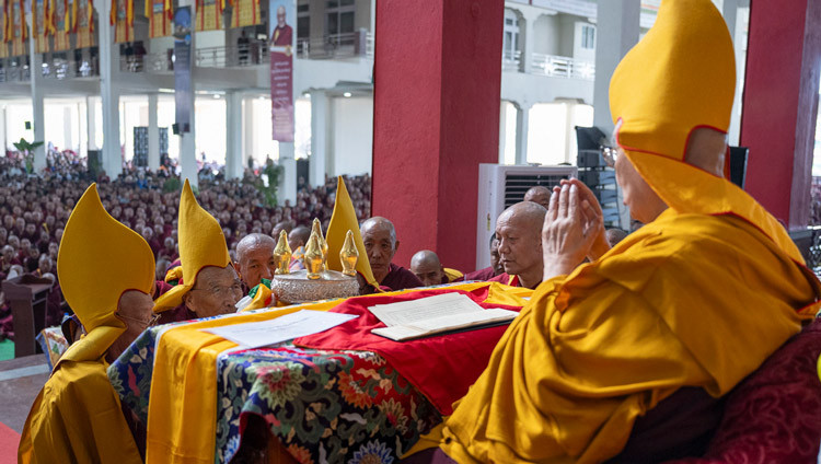 Gaden Tripa Lobsang Dorje presenting traditional offerings to His Holiness the Dalai Lama during Ganden Ngamchö Celebrations at Drepung Monastery in Mundgod, Karnataka, India on December 14, 2025. Photo by Ven Zamling Norbu