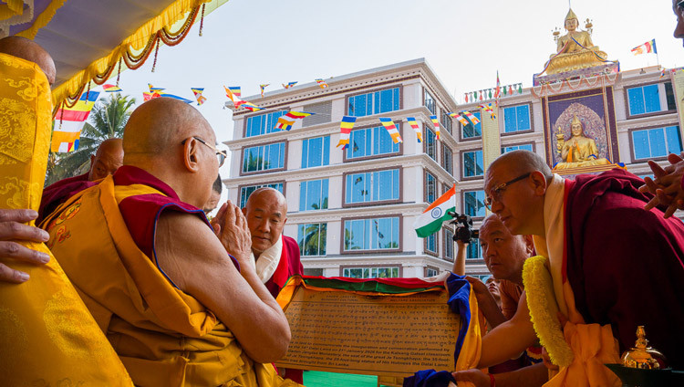 His Holiness the Dalai Lama being shown a plaque about the new Jangtse College new classroom building and library, and his having consecrated them on his way to attend Long Life Prayers at Gaden Monastery in Mundgod, Karnataka, India on January 21, 2026. Photo by Tenzin Choejor