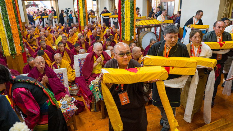 A procession of people bearing offerings filing past His Holiness the Dalai Lama during the Long Life Prayers at the Main Tibetan Temple in Dharamsala, HP, India on February 23, 2026. Photo by Tenzin Choejor