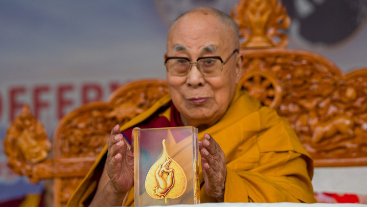 His Holiness the Dalai Lama with the Karuna Ratna, offered to him by the Core Group for the Tibetan Cause—India during the Long Life Prayers at the Main Tibetan Temple courtyard in Dharamsala, HP, India on March 11, 2026. Photo by Tenzin Choejor