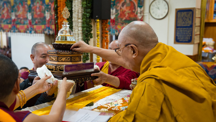 The Association of People from Dokham Zachuka presenting His Holiness the Dalai Lama with a special memento during the Long Life Offering Ceremony at the Main Tibetan Temple in Dharamsala, HP, India on March 25, 2026. Photo by Tenzin Choejor