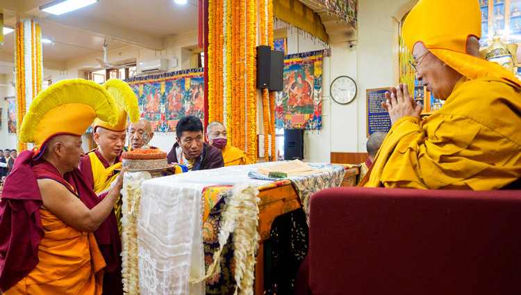 Kundeling Rinpoché, with the former President of the Dokham Chushi Gangdruk and the President of the Himalayan Buddhist Cultural Association, offering a mandala to HIs Holiness the Dalai Lama during the Long Life Prayers at the Main Tibetan Temple in Dharamsala HP, India on May 20, 2026. Photo by Tenzin Choejor