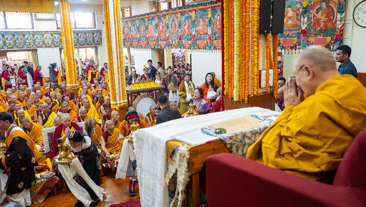 Members of the two groups offering prayers filing past His Holiness the Dalai Lama holding offerings during the Long Life Prayers at the Main Tibetan Temple in Dharamsala HP, India on May 20, 2026. Photo by Tenzin Choejor