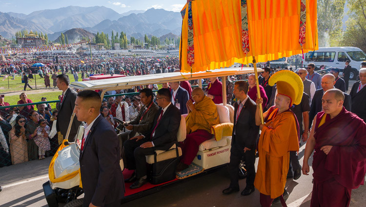 His Holiness the Dalai Lama riding in a golf cart from his residence to the pavilion at Shewatsel Teaching Ground to attend a Long Life Offering Ceremony offered to him by the Ladakh Buddhist Association, the All Ladakh Gonpa Association and the Tibetan Community of Ladakh in Leh, Ladakh, India on August 30, 2026. Photo by Tenzin Choejor