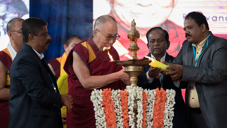 His Holiness the Dalai Lama joins in lighting a lamp at the start of the program at Tumkur University in Tumakuru, Karnataka, India on December 26, 2017. Photo by Tenzin Choejor