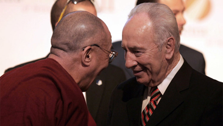 File photo of His Holiness the Dalai Lama with Late Shimon Peres at the Second Petra Conference of Nobel Laureates on 21 June, 2006. Photo/Getty Image