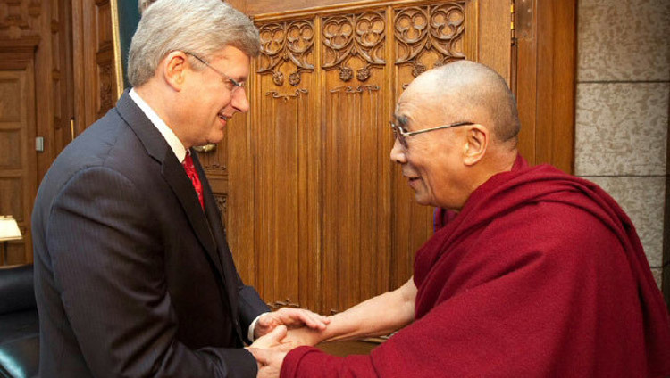 Canadian Prime Minister Stephen Harper greets His Holiness the Dalai Lama at his office on Parliament Hill in Ottawa on April 27, 2012. (Photo by Andrew MacDougall)