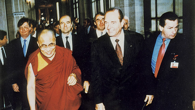 His Holiness the Dalai Lama walking with French President Jacques Chirac in Paris, France on December 8, 1998.