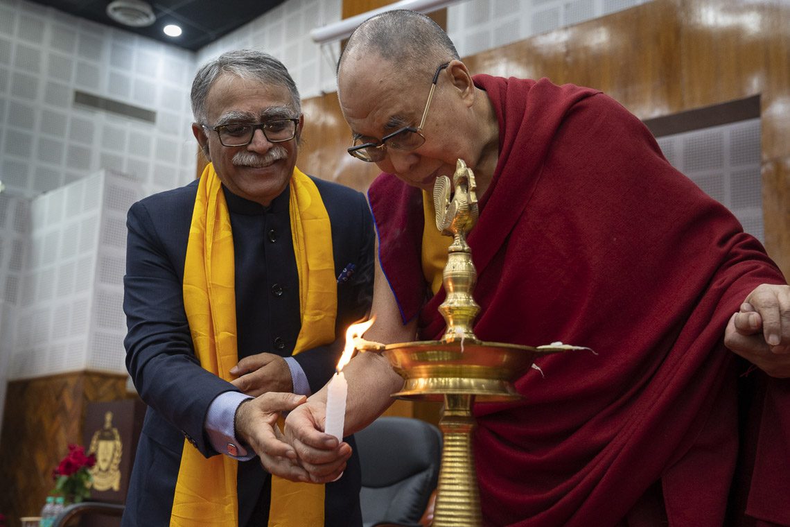 Dalai Lama lighting a lamp to open the program in Bihar.