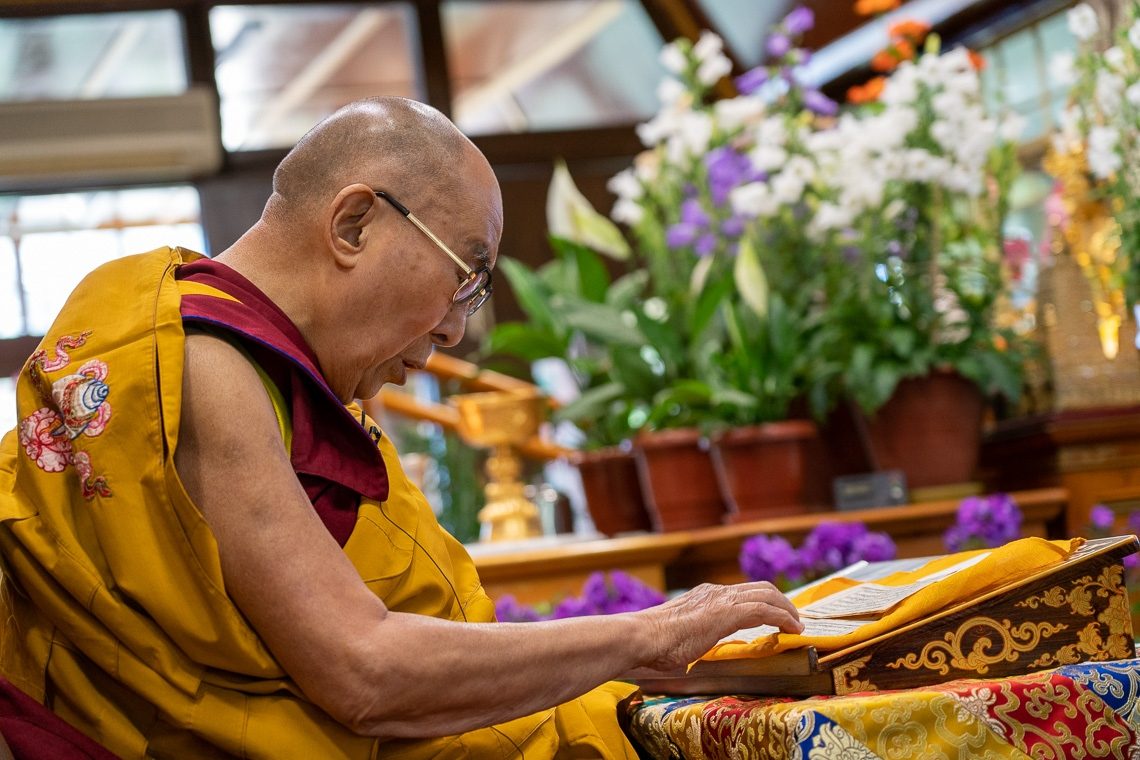 His Holiness reading